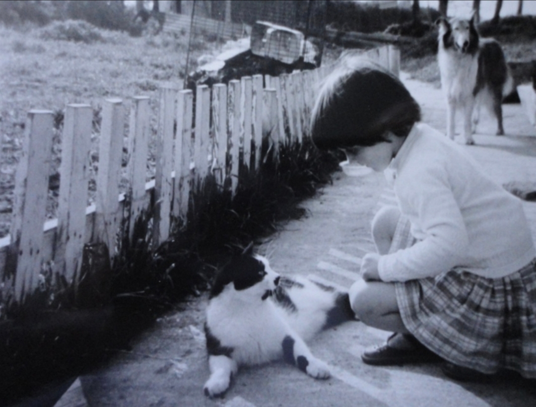Lucy as a child with her cat